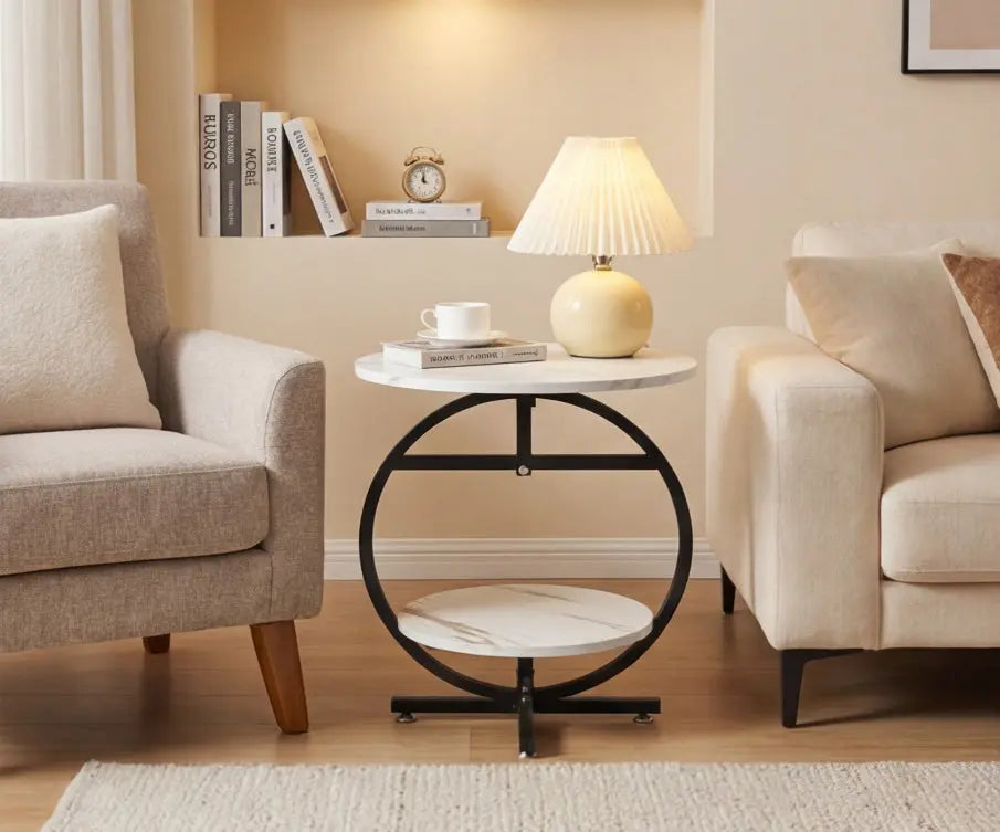 Living room with beige armchair, sofa, and round side table with lamp.
