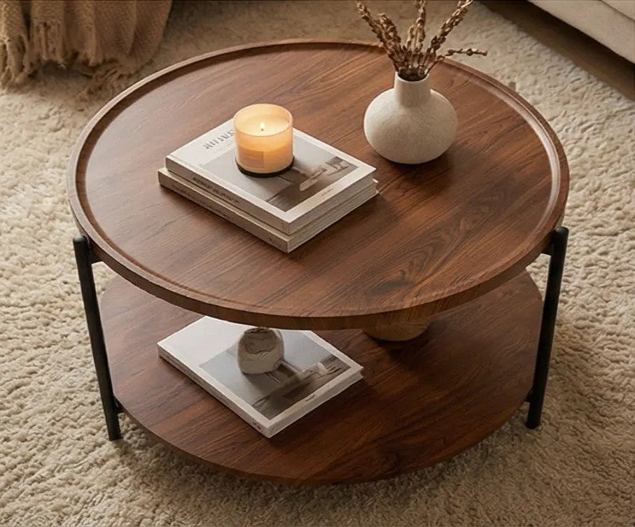 Wooden coffee table with books and a candle on a carpeted floor