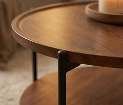 Wooden side table with a candle on a blurred background
