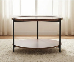Round wooden coffee table with a white shelf in a room with light curtains.