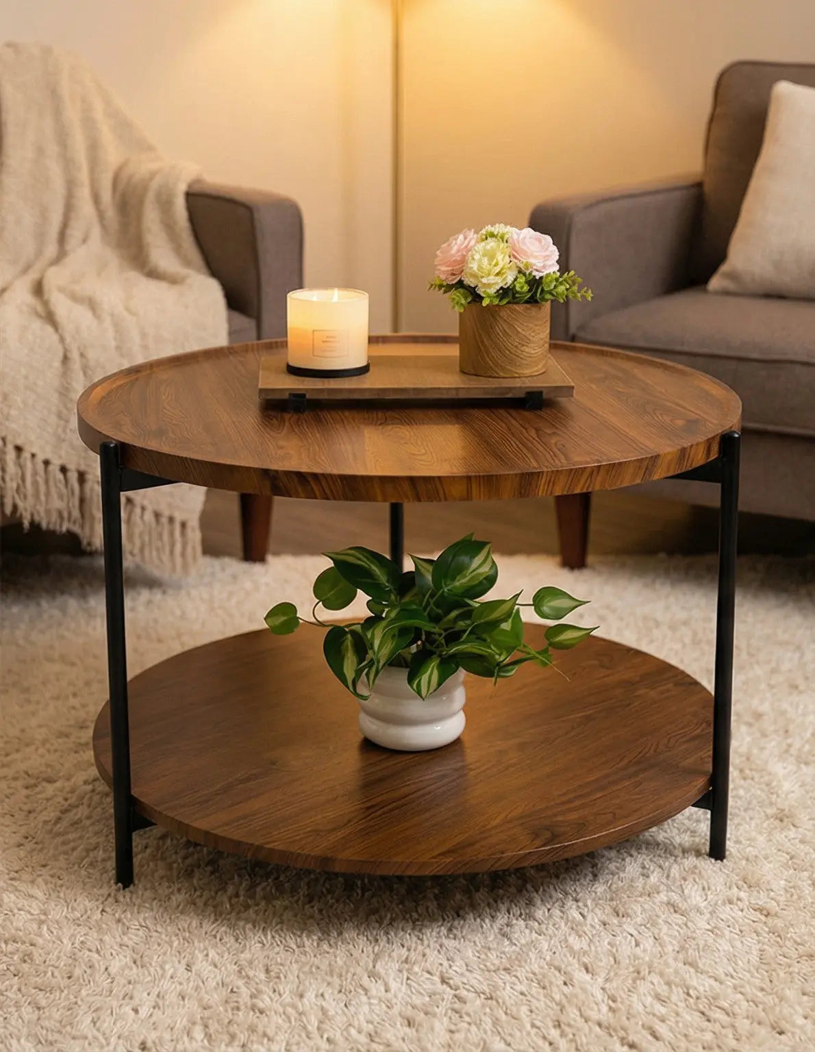 Wooden coffee table with a candle and plant in a living room setting