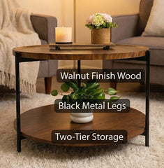 Round wooden coffee table with black metal legs in a living room setting.